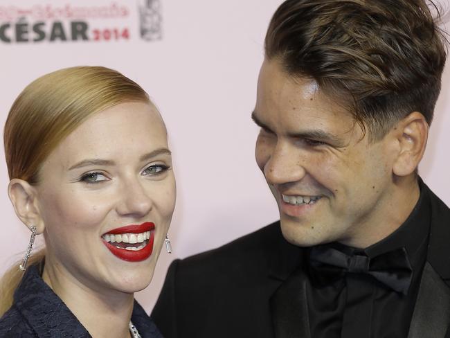 FILE - In this Feb. 28, 2014 file photo, U.S. actress Scarlett Johansson, left, and her partner Romain Dauriac arrive at the 39th French Cesar Awards Ceremony, in Paris. Johansson is a first-time mom. A spokesman for the 29-year-old actress said Thursday, Sept. 4, 2014, that Johansson and her fiance, Dauriac, have welcomed a baby girl, whom they’ve named Rose. (AP Photo/Lionel Cironneau, file)