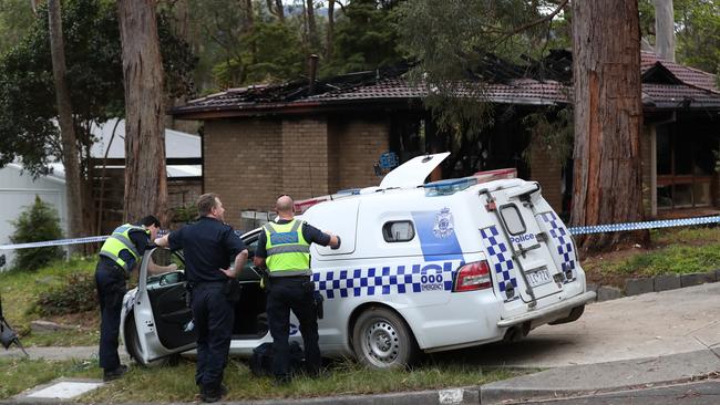 Police at the scene of the Upwey fire. Picture: David Crosling