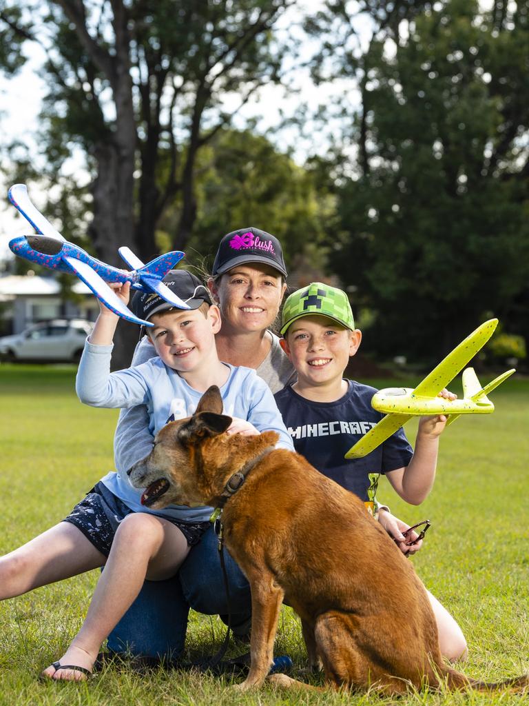 Rebecca Bridge with her sons Bradley (left) and James and their dog Jacey during Mother's Day celebrations in the Queensland State Rose Garden, Newtown Park, Sunday, May 8, 2022. Picture: Kevin Farmer