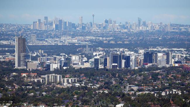 Parramatta city skyline in front of Sydney CBD in background.