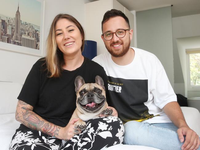 Sarah Prgomelja, 30, and fiance Jamie Hayman, 29. They leave the aircon on to keep their dog Edgar cool and sleep with it on when it’s hot. Picture: Richard Dobson 