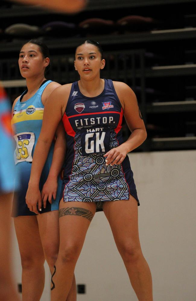 Gold Coast Titans v Brisbane South Wildcats U18 Nissan State Titles. Pictured: Siana Matavalea (navy) and Roxy Rhind (blue)