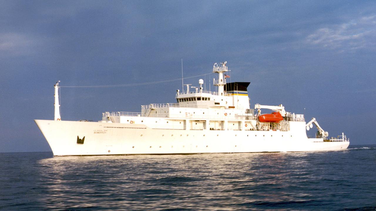 China’s military has dispatched warships to challenge two US Navy vessels that sailed through disputed territory in the South China Sea.