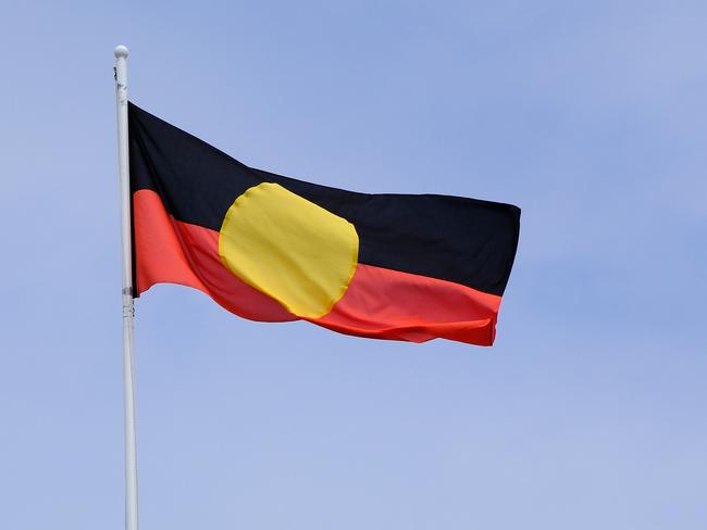 MELBOURNE, AUSTRALIA - NewsWire Photos JANUARY, 15, 2023: Th Aboriginal flag is seen at the Victorian Parliament building. Picture: NCA NewsWire / Luis Enrique Ascui