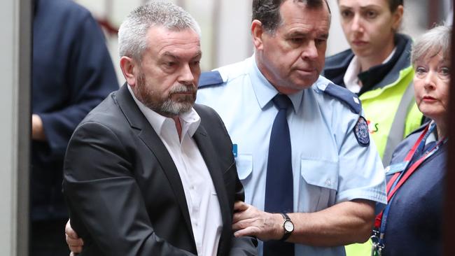 Borce Ristevski being led into court from arrives a prison van in August. Picture: David Crosling