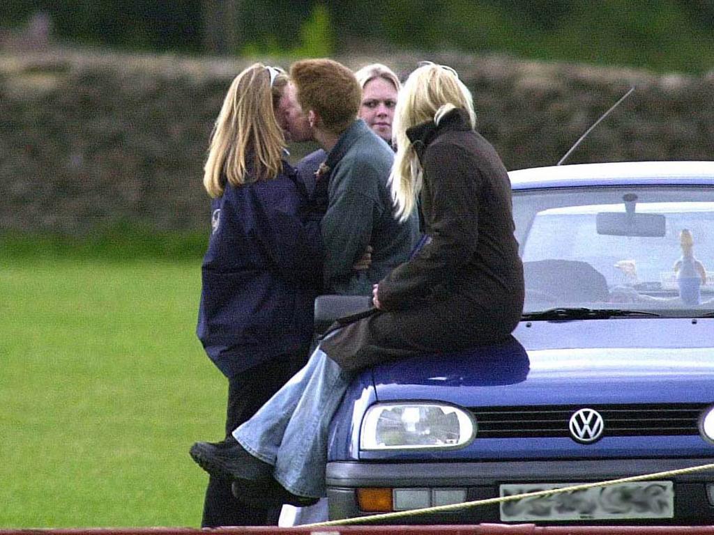 Sasha Walpole looks on as a teenage Prince Harry kisses a friend. Picture: Getty Images