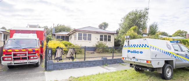 Investigators and police attend the site of an overnight house fire on Brooker Highway, Lutana. Picture: Richard Jupe