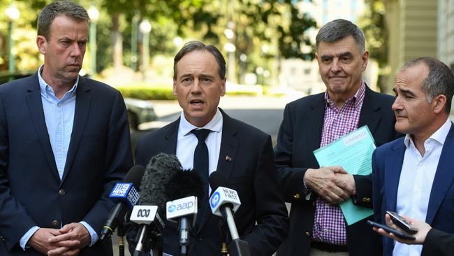 Minister for Education Dan Tehan with Minister for Health Greg Hunt, Chief Medical Officer Brendan Murphy and Victorian Deputy Premier James Merlino. Picture: AAP /Erik Anderson