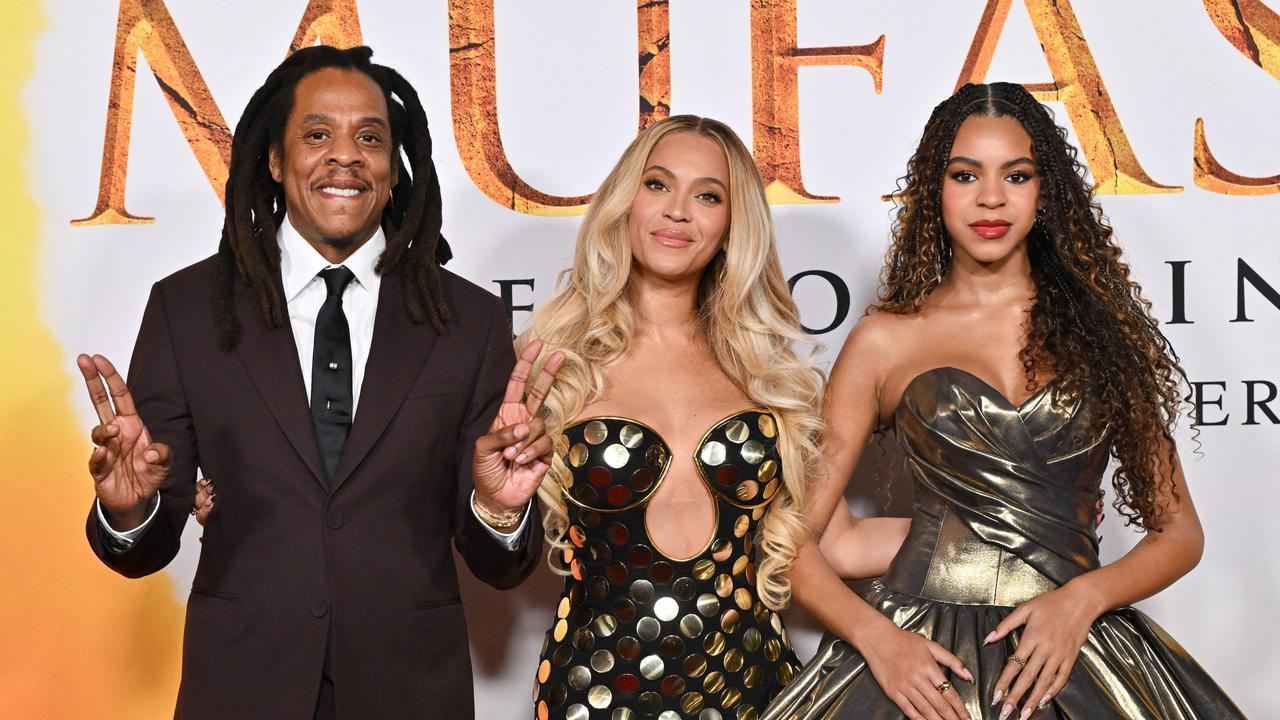 US rapper Jay-Z, singer-songwriter Beyonce and their daughter Blue Ivy Carter. (Photo by Lisa O'CONNOR / AFP)