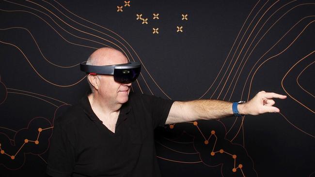 Technology journalist Chris Griffith tries Microsoft HoloLens.