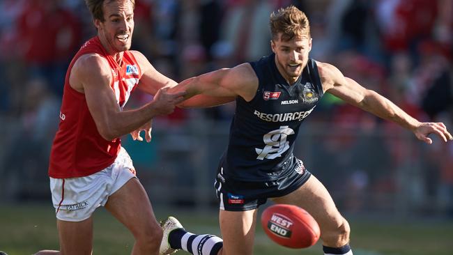 South's Xavier Gotch gets free from North's George Thring at Prospect Oval. Picture: Matt Loxton