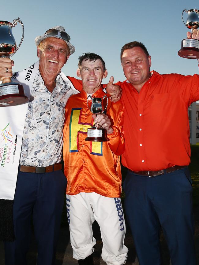 Owner Tom Hedley, jockey Robert Thompson and trainer Stephen Massingham celebrate after The Harrovian wins the Cairns Amateurs Cup at Cannon Park. PICTURE: BRENDAN RADKE.