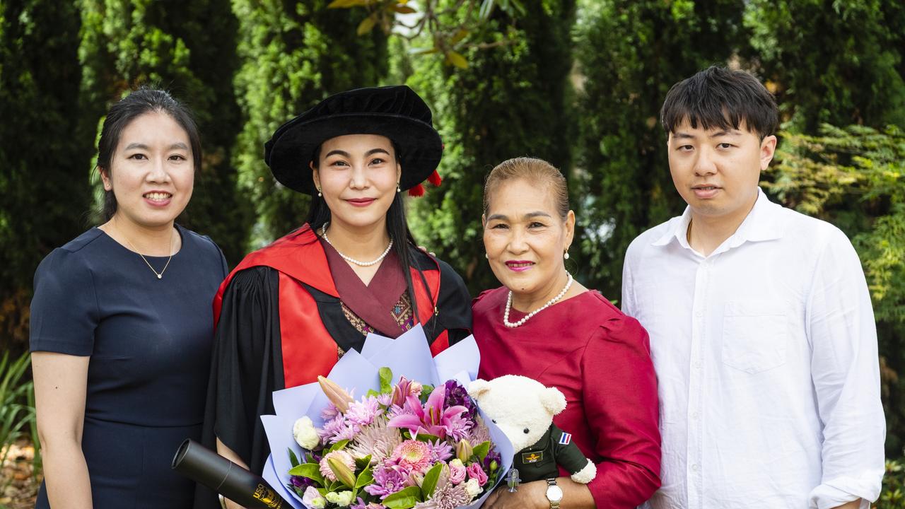 Doctor of Philosophy graduate Maneerat Tianchai with mum Nuanmanee Termthanam and friends Pauling Chang and Kachun Tse at the UniSQ graduation ceremony at Empire Theatres, Tuesday, December 13, 2022.