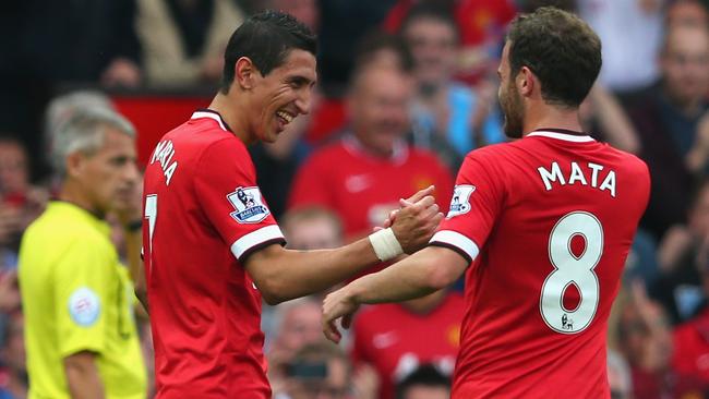 MANCHESTER, ENGLAND - SEPTEMBER 14: Angel Di Maria of Manchester United is congratulated by team-mate Juan Mata after scoring the first goal during the Barclays Premier League match between Manchester United and Queens Park Rangers at Old Trafford on September 14, 2014 in Manchester, England. (Photo by Alex Livesey/Getty Images)