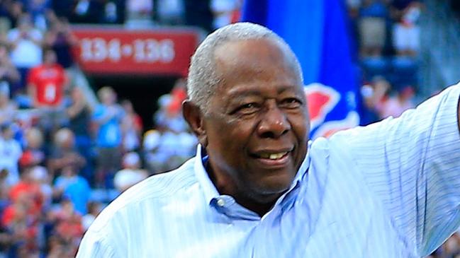 (FILES) In this file photo taken on October 02, 2016, Hall of Famer Hank Aaron throws out the ceremonial last pitch at Turner Field to Bobby Cox after the game between the Atlanta Braves and the Detroit Tigers at Turner Field in Atlanta, Georgia. - Hank Aaron, the baseball great who  defied racist hatred to break Babe Ruth's cherished major league home run record, died January 22, 2021. He was 86. The Atlanta Braves, Aaron's former club, and Major League Baseball said the beloved Hall of Famer affectionately known as "Hammerin' Hank" passed away Friday morning. (Photo by Daniel Shirey / GETTY IMAGES NORTH AMERICA / AFP)