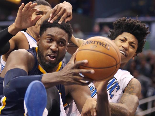 Indiana’s Roy Hibbert, left, takes the ball from Orlando Magic guard Elfrid Payton.