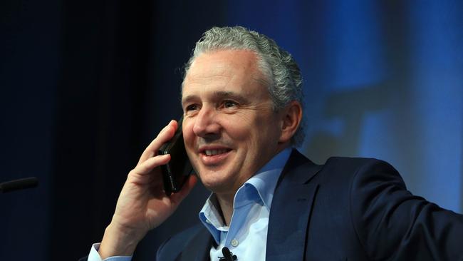 Telstra CEO Andy Penn takes a phone call ahead of the company's full year results. Aaron Francis/The Australian