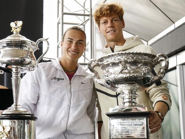 MELBOURNE, AUSTRALIA - JANUARY 09: Aryna Sabalenka of Belarus poses with the Daphne Akhurst Memorial Cup along side Jannik Sinner of Italy with the Norman Brookes Challenge Cup during the draw for the 2025 Australian Open at Melbourne Park on January 09, 2025 in Melbourne, Australia. (Photo by Daniel Pockett/Getty Images)