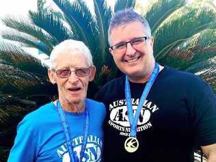 STRONG: Derek Mason, 80, is a world record holder, with coach John Ross. Picture: Contributed