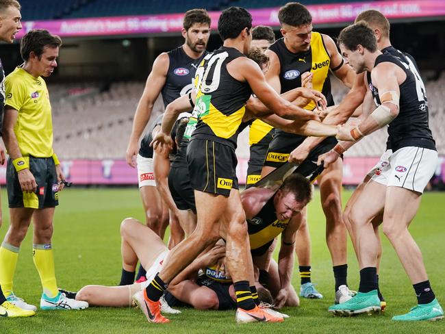 Jack Riewoldt of the Tigers gets involved in a wrestle during the Round 1 AFL match between Richmond and Carlton at the MCG in Melbourne, Thursday, March 19, 2020. (AAP Image/Michael Dodge) NO ARCHIVING, EDITORIAL USE ONLY