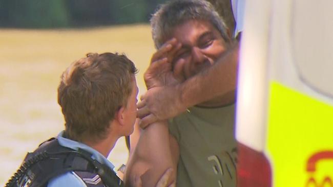 Distraught loved ones broke down on the banks of the river. Picture: TNV