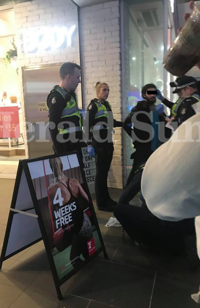 A suspect in the horrific road death of a Dutch woman being arrested on Bourke St. Picture: Milad Noori