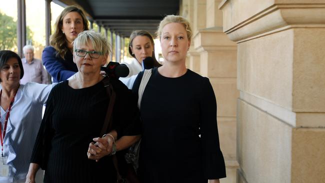 Bettina Schmoock, right, leaves court with a supporter after being sentenced. Picture: Morgan Sette/AAP