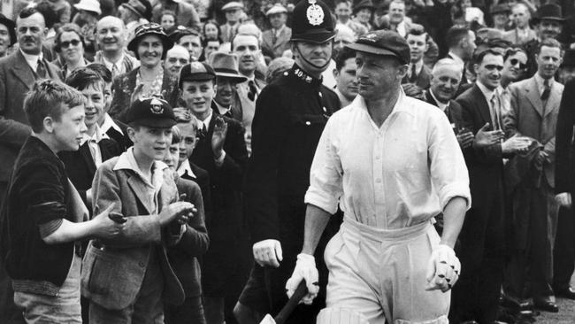 Spectators applaud Don Bradman as he takes the field during the fourth Test match at Headingley in 1938. Picture: Getty Images