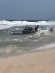 Footage by Queensland Police show the Canungra man the Ute through the window.