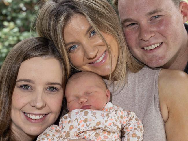 December 30, 2024: Surrogate Emily with Sarah and Tom Starkey with new baby Savannah Emily-Joan Starkey at their home. Picture: Kelly Barnes