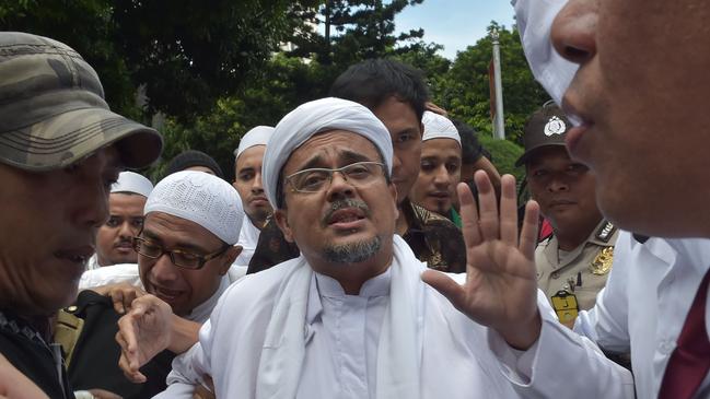 The leader of the Indonesian Muslim hardline group the Front Pembela Islam (FPI), Rizieq Shihab, arrives at the Jakarta police headquarters in Jakarta in 2017. Picture: AFP