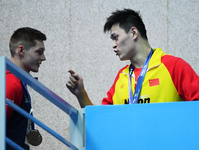 GWANGJU, SOUTH KOREA - JULY 23: Sun Yang (R) of China speaks with Duncan Scott of Great Britain during the medal ceremony for the Men's 200m Freestyle Final on day three of the Gwangju 2019 FINA World Championships at Nambu International Aquatics Centre on July 23, 2019 in Gwangju, South Korea. (Photo by Quinn Rooney/Getty Images)