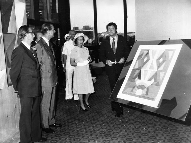 The Queen and Prince Philip look at artwork in the foyer of the Adelaide Festival Theatre with German sculptor Otto Herbert Hajek.
