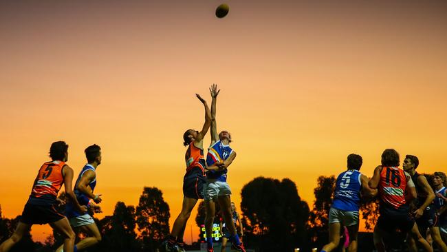 Ruckmen James Westphal and Jas Corless fly for a tap out in the evening sun. Picture: Getty Images.