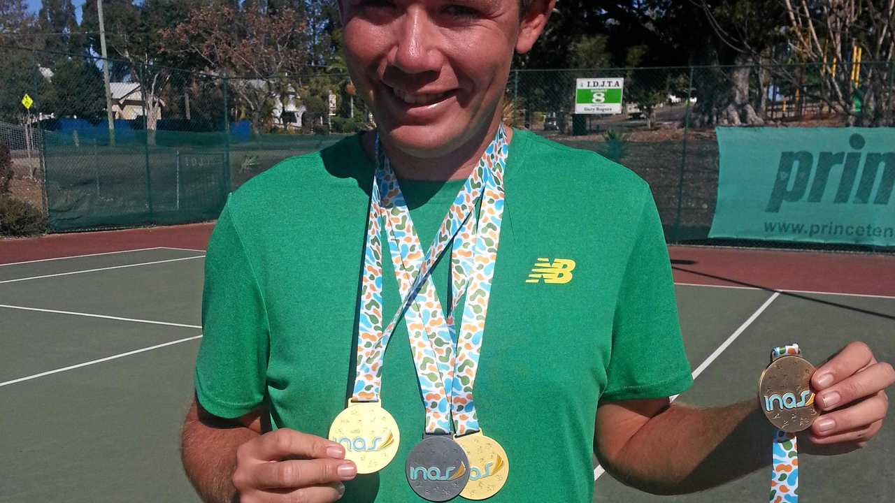 Ipswich tennis player and world number one Archie Graham with the four medals he won at the INAS World Championships in Paris. Picture: David Lems