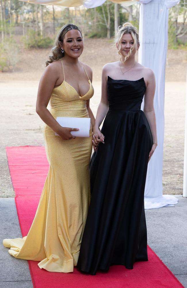 Ebony Bowater and Laura Fanshaw arrive at the Gympie State High School formal 2023. November 16, 2023. Picture: Christine Schindler