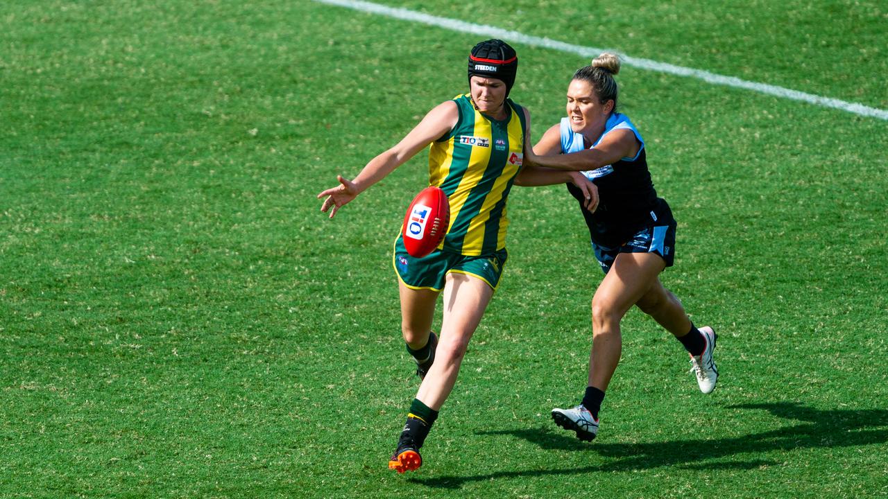 2020-21 NTFL Women's Premier League Grand Final - Darwin Buffettes v PINT Queenants. Claudia Fabris gets a kick off before being chased down. Photograph: Che Chorley