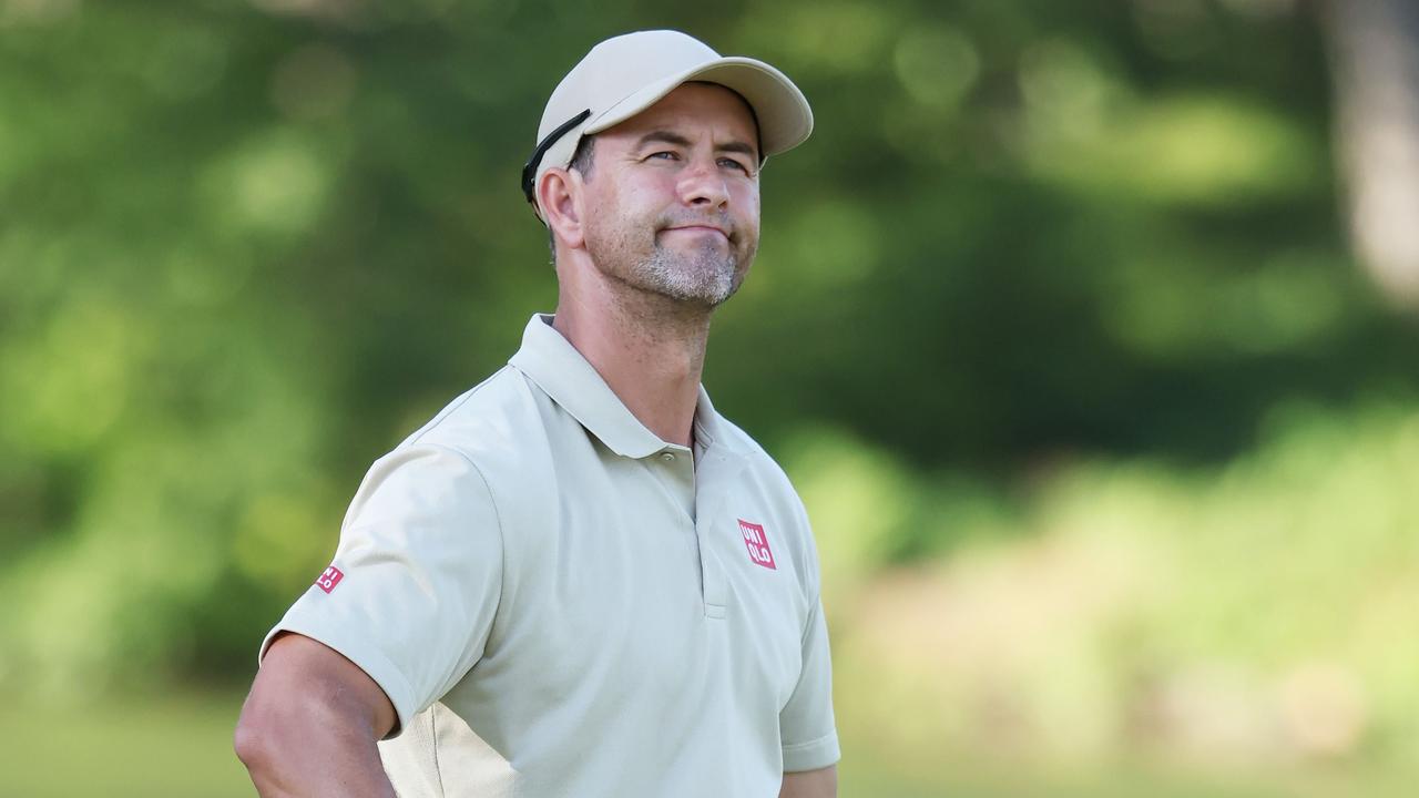 Adam Scott reacts after missing a putt on the ninth green.