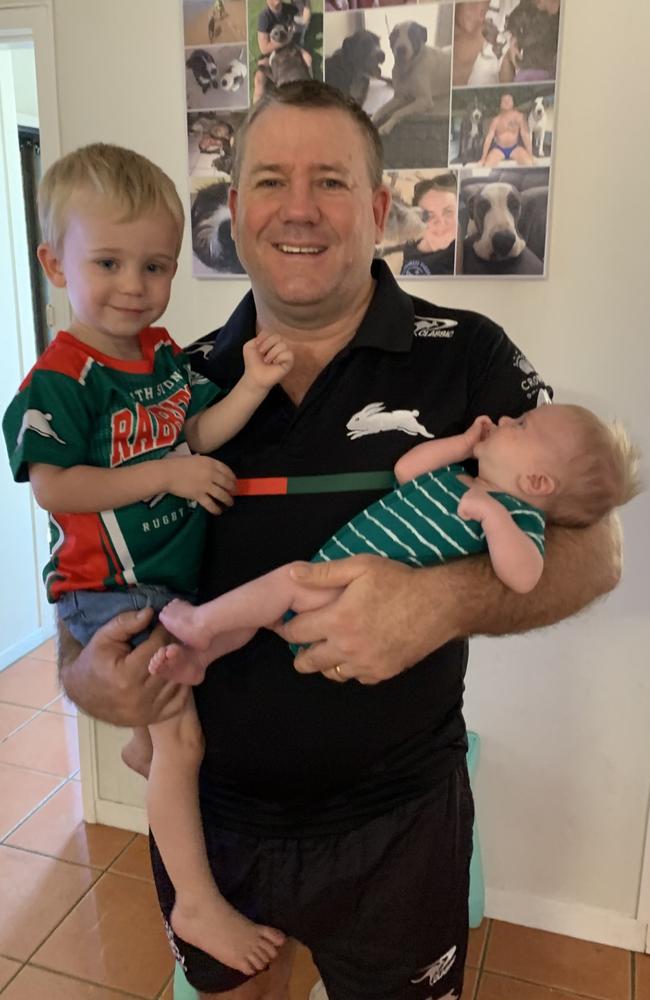 Townsville man Steve Willey, formerly of Ingham and Mount Isa, with boys George and Tom. Mr Willey, a former avid rugby league player, amateur boxer and dirt-bike rider, is battling aggressive degenerative chronic traumatic encephalopathy (CTE) in hopes of seeing both children, aged two and four, start school. Picture: Supplied