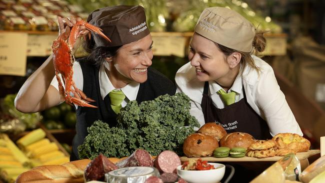 Frewville Foodland's Rachael Godley (bakery) & Sienna Polychronopoulos (deli) with some of the products on offer at store. The supermarket was today named the world's best international retailer by it's global peers. picture: Bianca De Marchi