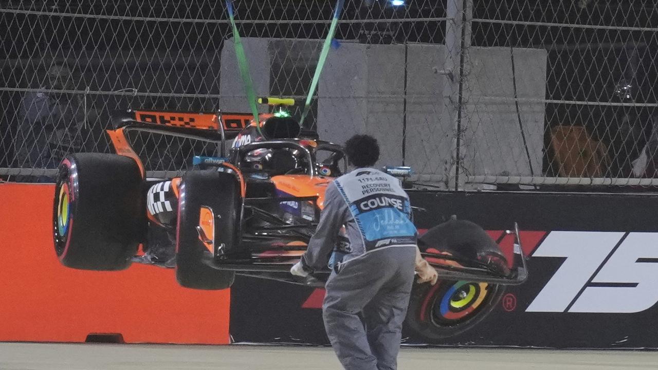 McLaren driver Lando Norris' car is lifted off the track after he crashed during qualifying. Picture: Getty