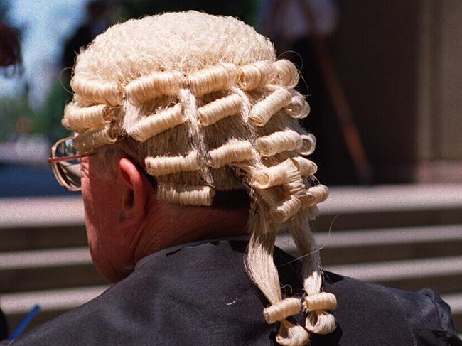 Barrister wearing wig and gown. Court. Law. Justice.