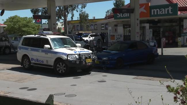 Police at a service station in Narellan where a confrontation unfolded with the driver of an alleged stolen vehicle today Picture: TNV