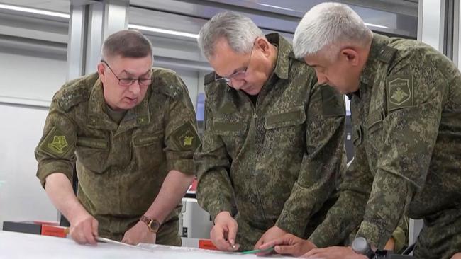 Sergei Shoigu, centre, visits commanders on Monday. Picture: AFP