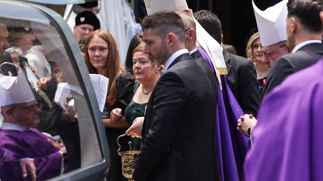 Margaret Andrews farewells her husband following his state funeral at St Patrick’s Cathedral in Melbourne. Picture: Ian Currie/NewsWire