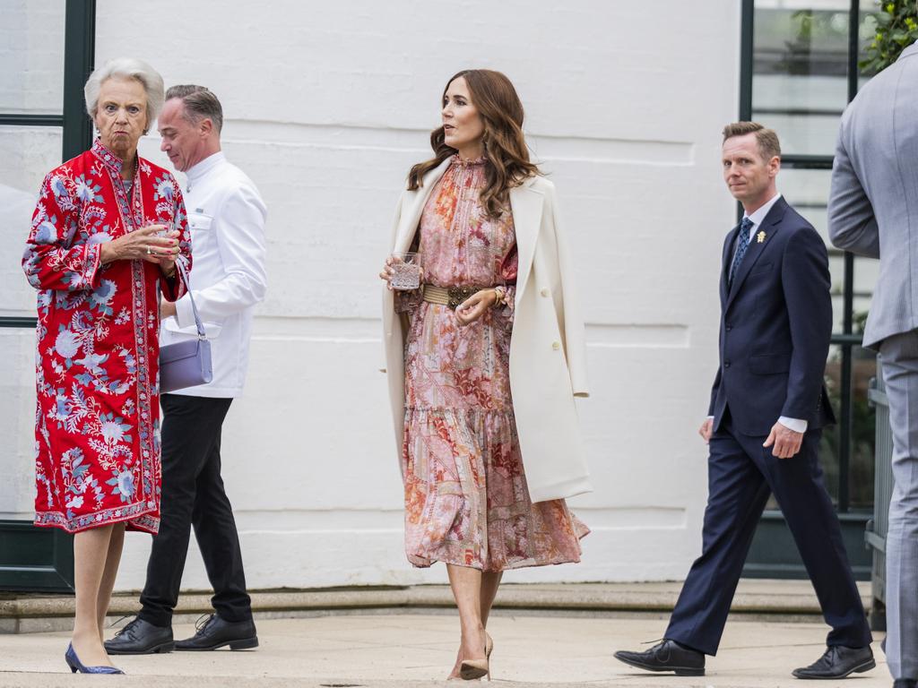 Mary teamed the floral outfit with a white trench coat. Picture: Getty Images