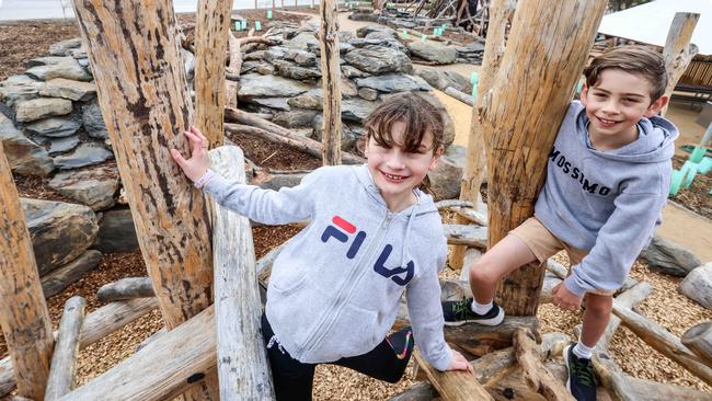 Zoe, 8, with brother Samuel, 11, at the opening of Glenthorne National Park-Ityamaiitpinna Yarta Adventure playground. Image: Russell Millard Photography