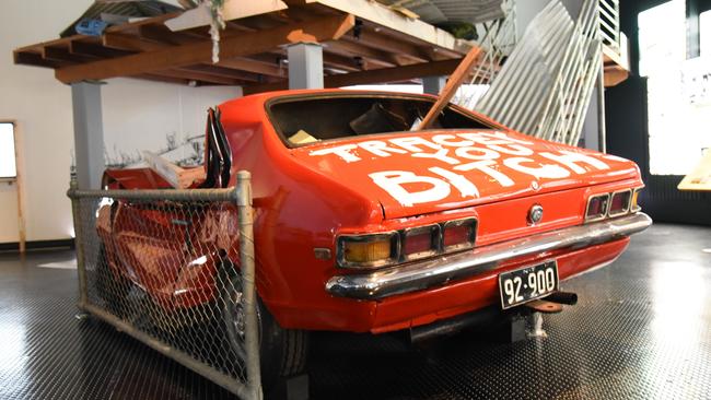 'Tracey You Bitch': Darwin resident John Garner's crushed Holden Torana has been recreated for the Museum and Art Gallery of the Northern Territory's reopened Cyclone Tracy exhibition. Picture: Alex Treacy