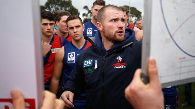 Leigh Adams talks to his players during a game last year.