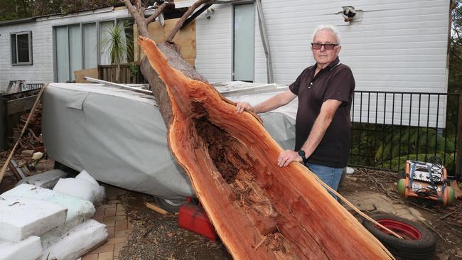 Damage from the storms that brought tornados and flooding rains to Mt Tamborine. David Hanmore marvels at how lucky they were to escape with minor injuries after a tree went through their home on Kinabalu Drive. Picture Glenn Hampson